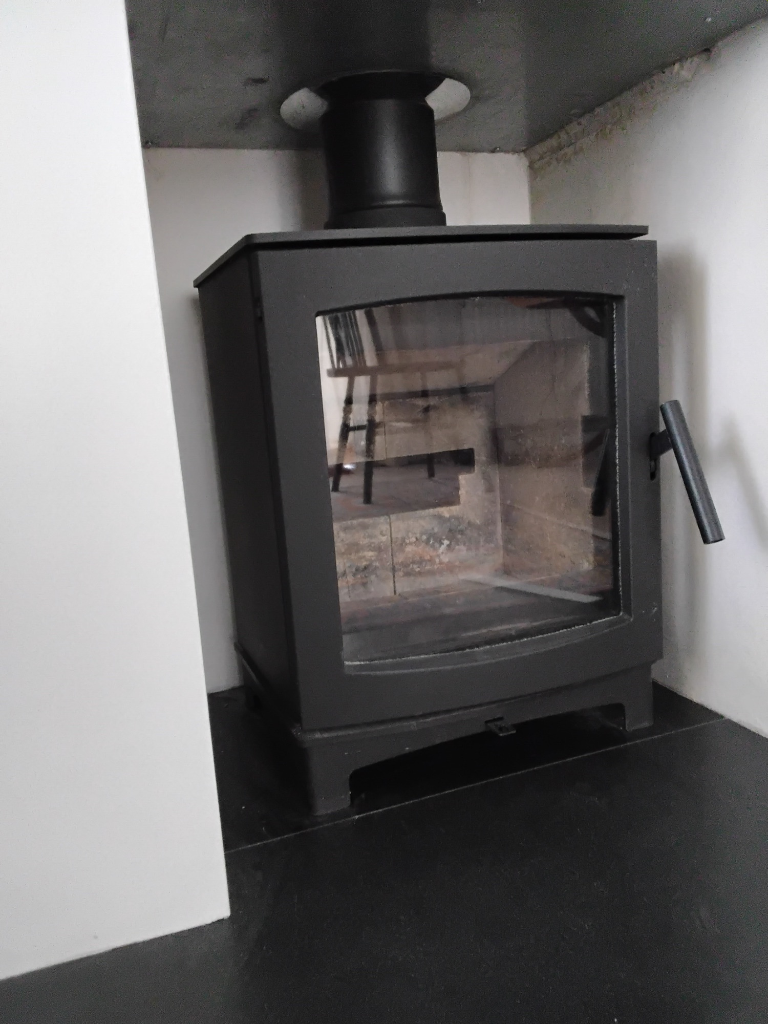 Cast iron stove and wood store